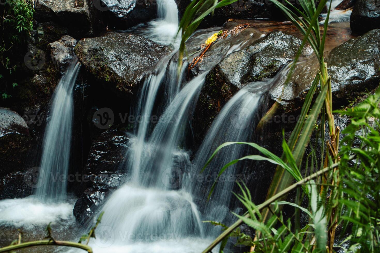 This unspoiled seasonal waterfall in the middle of the wilderness is called the Grenjengan Kembar waterfall. Detailed photos of the waterfall using a slow shutter speed technique