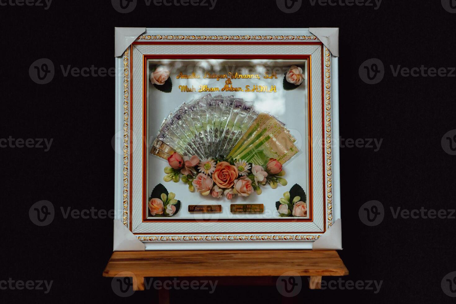 Wedding gift box with Indonesian culture. The dowry is in the form of banknotes that are beautifully and attractively decorated in white and gold frames photo