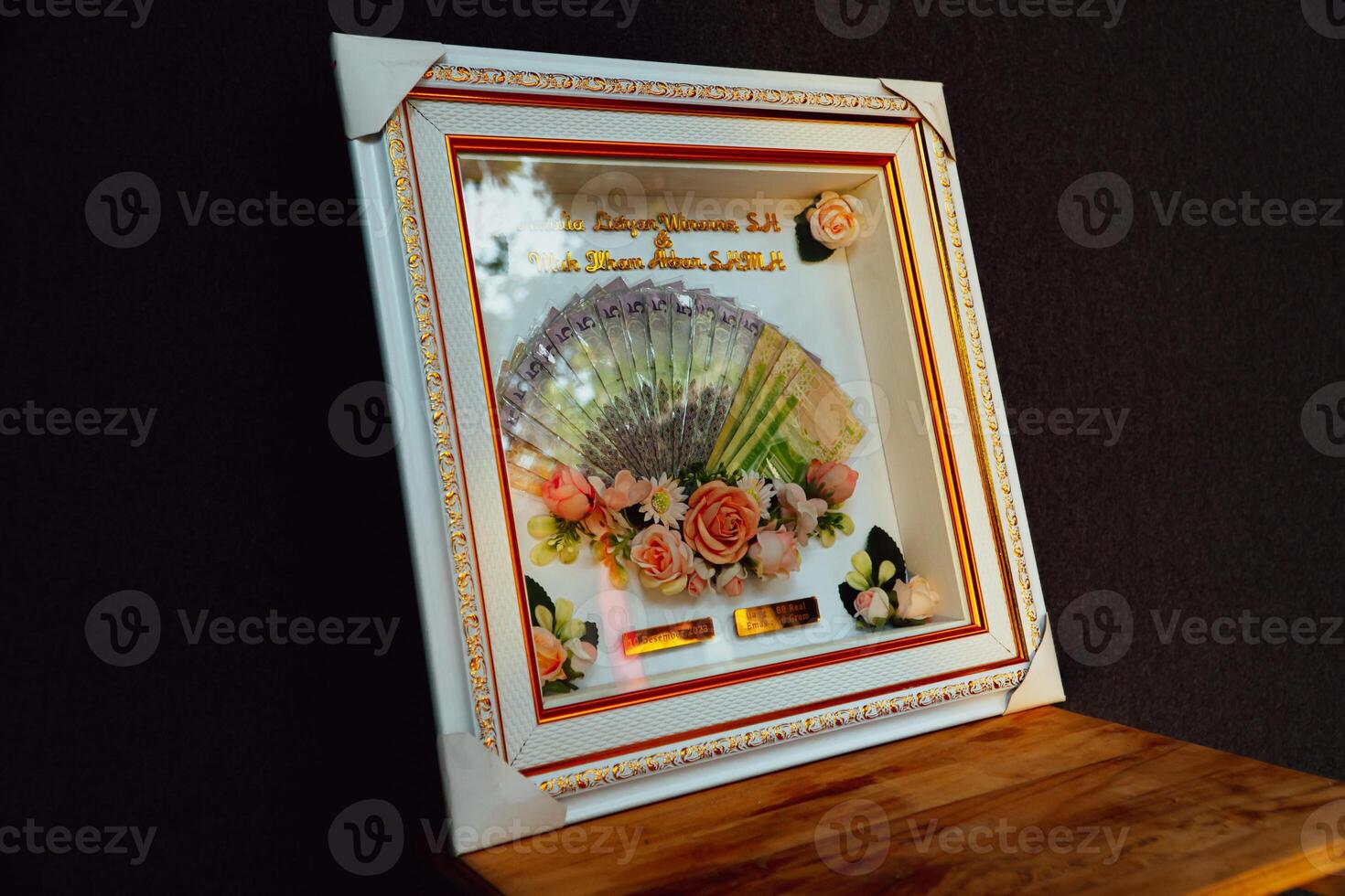 Wedding gift box with Indonesian culture. The dowry is in the form of banknotes that are beautifully and attractively decorated in white and gold frames photo