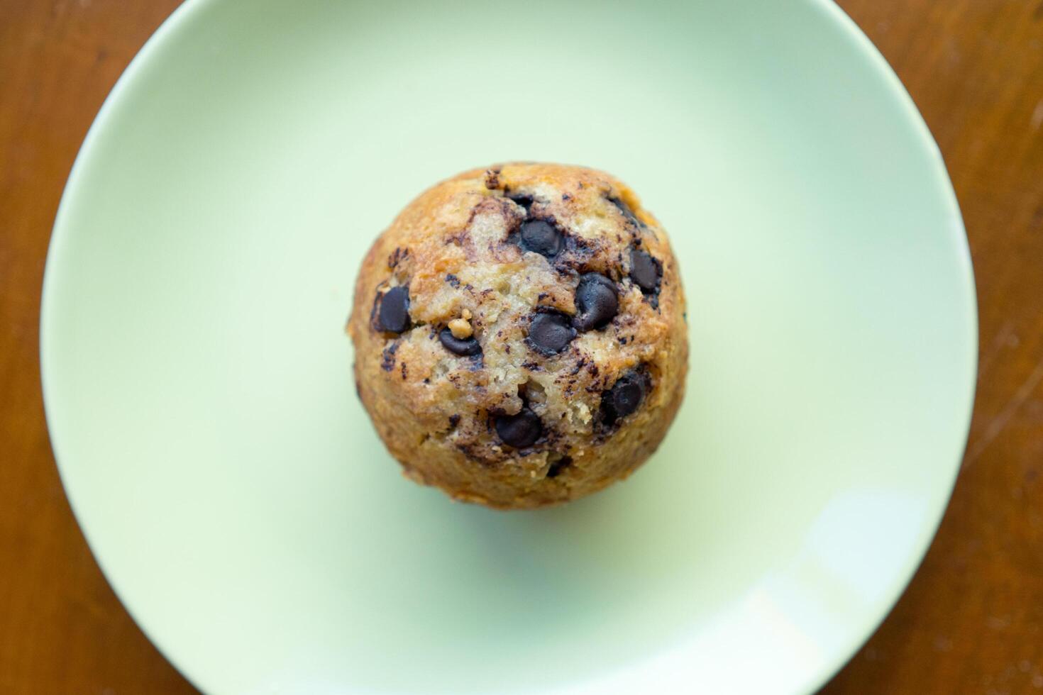 Top view of banana muffin on the plate with wood table photo