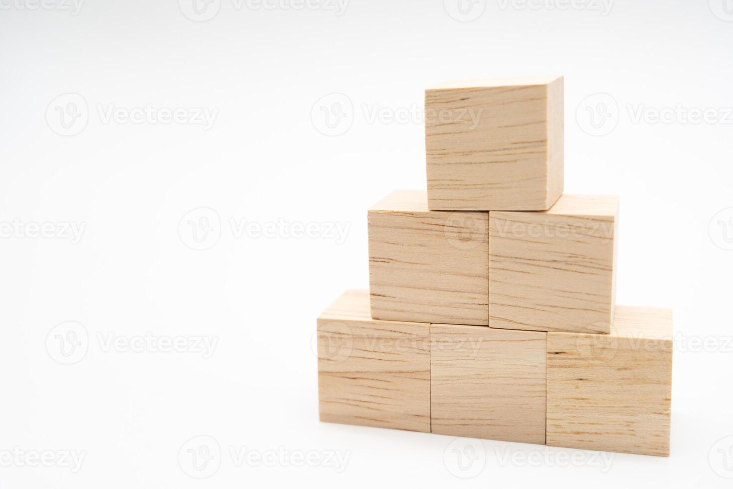 Cube shape wooden block toy stacked in pyramid shape without graphics for Business design concept. blank wooden cubes. photo