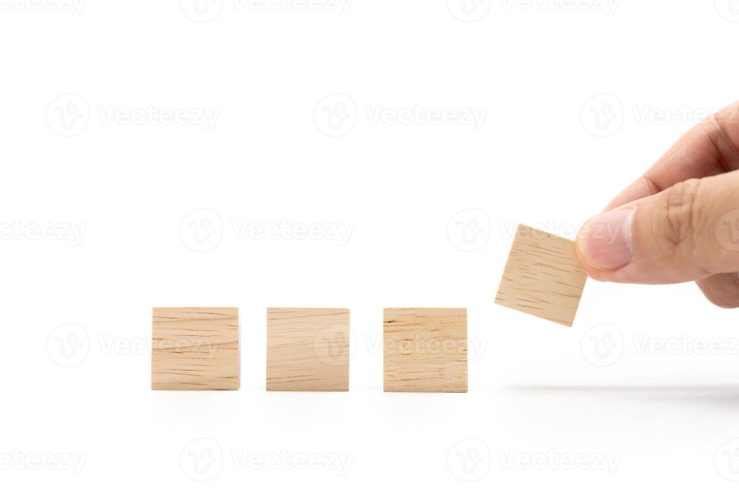 Hand place Blank wooden cube blocks for text isolated on white background. 4 Empty wooden blocks. Copy space. photo