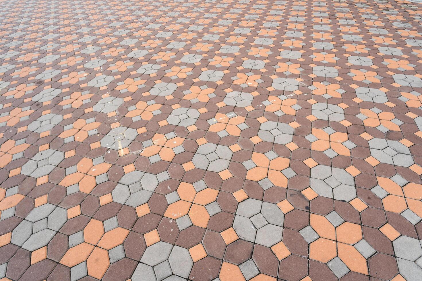Paver brick floor also call brick paving, paving stone or block paving. Abstract background from paving red tiles, bricks. photo