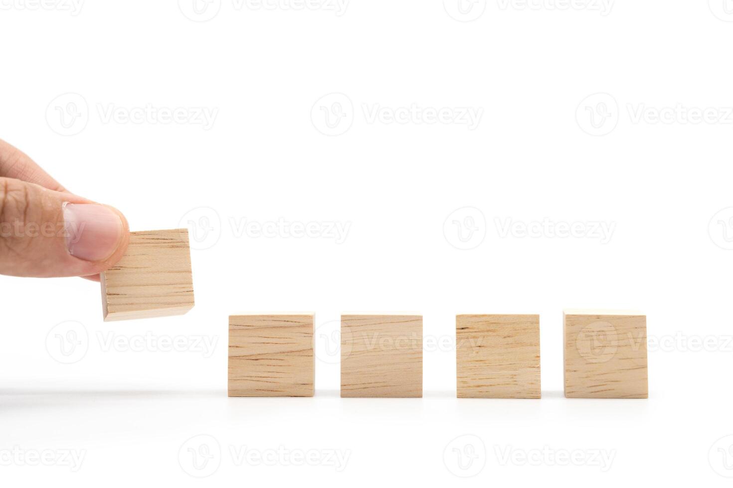 Hand place 5 Blank wooden cube blocks for text isolated on white background. 5 Empty wooden blocks. Copy space. Blank space for input wording and infographic icon. photo