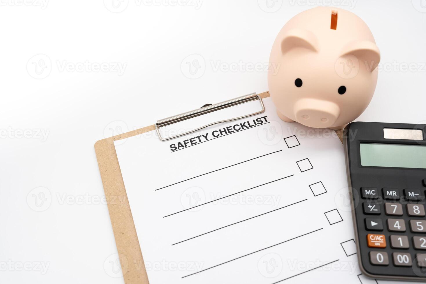 Blank Safety checklist with Calculator and Piggy Bank. safety for Business. Empty safety checklist form on white background. saving money for protection, planning in future. photo