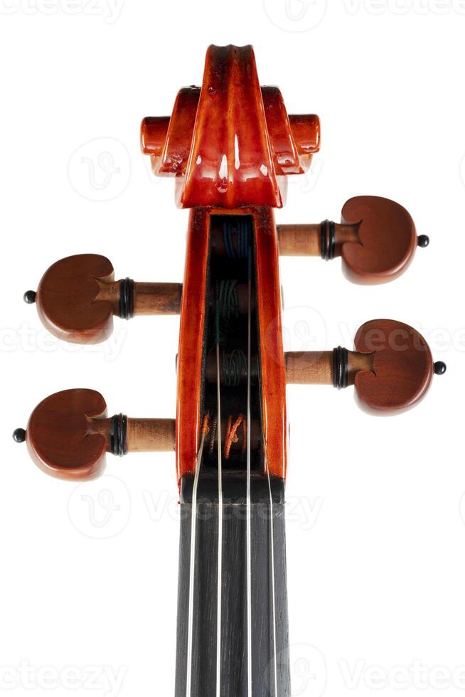 Close up of a violin scroll isolated on white background photo
