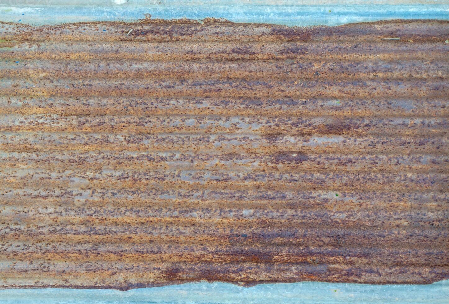Old galvanized sheet background with rust pattern. Used for decorating the walls of restaurants, coffee shops, vintage style, cowboy style, backdrop. photo