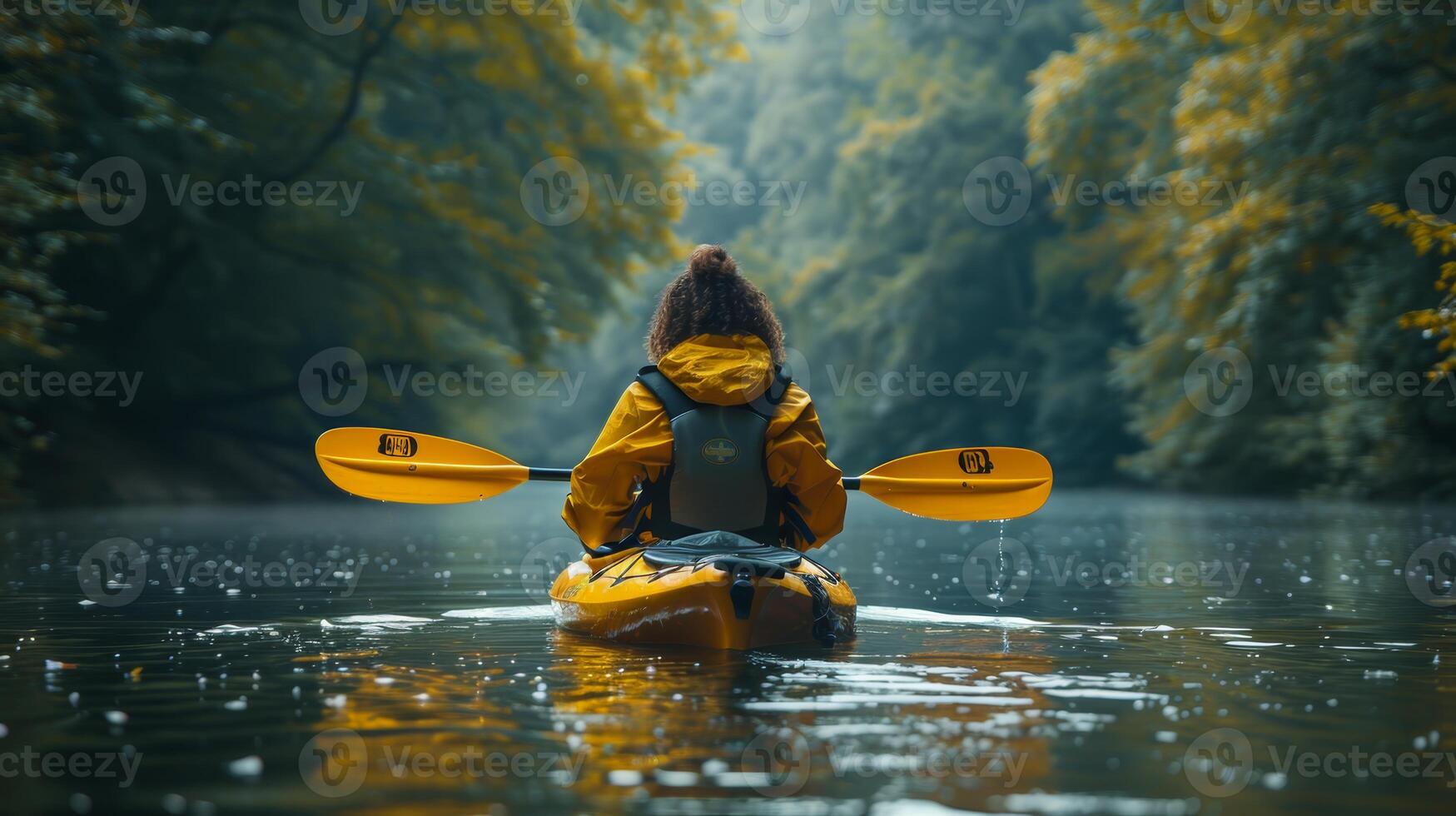 Serene Bisexual Woman Kayaking on a Calm River with Lush Greenery Surroundings photo