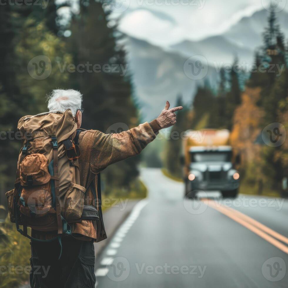 a man with a backpack pointing at a truck on the road photo