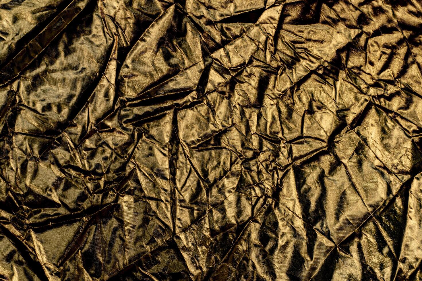 Gold crumpled paper for background wrinkled surface, design, wallpape photo
