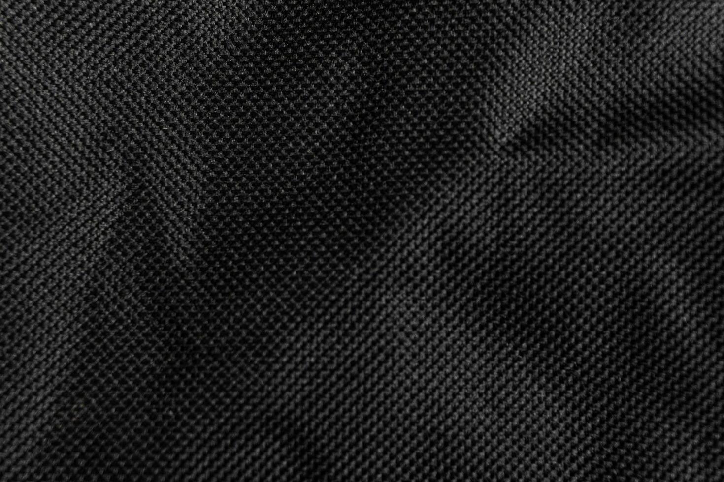 Black crumpled paper with shadow for background. wrinkled surface, design, wallpape photo
