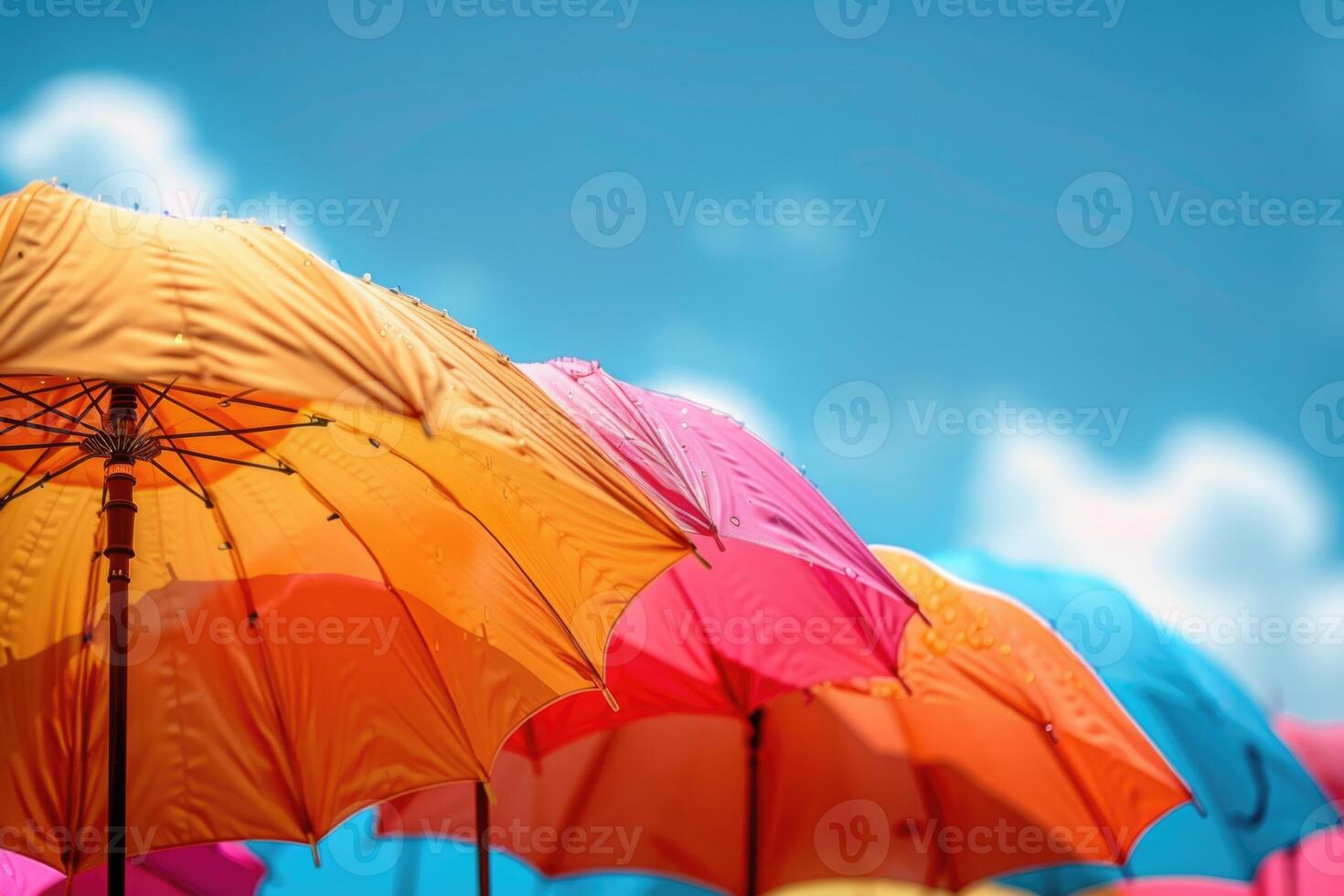 summer accessories sun umbrellas on sky background. photo