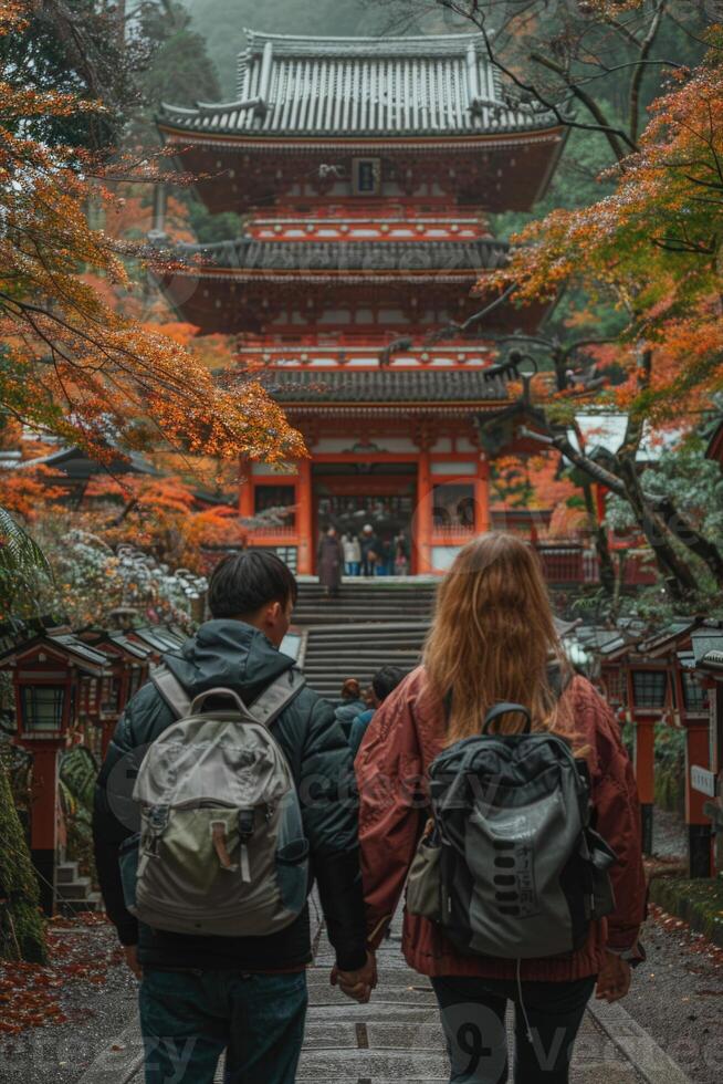couple traveling in Japan, visiting temple. photo