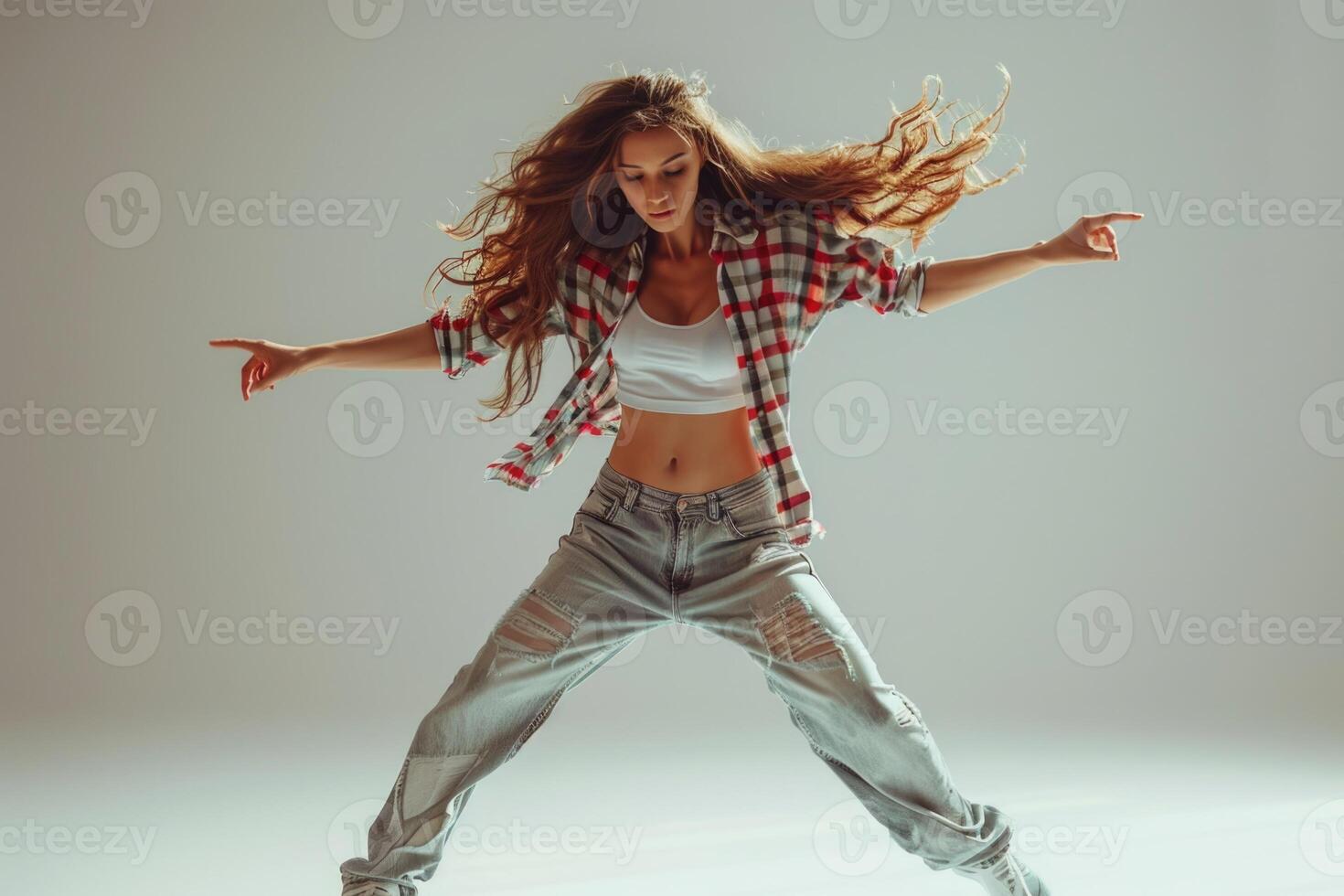 woman dancing breakdance in dancing studio. photo