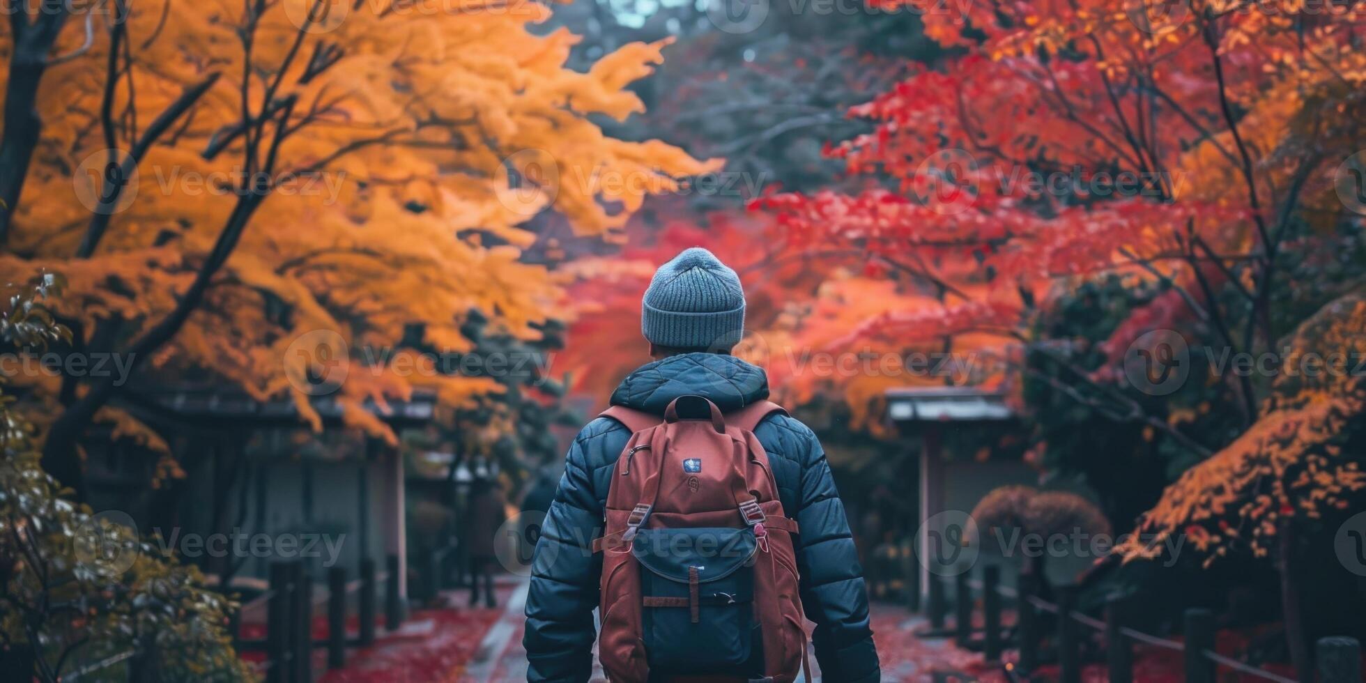man traveling in traditional japanese city Kyoto in momiji season. photo
