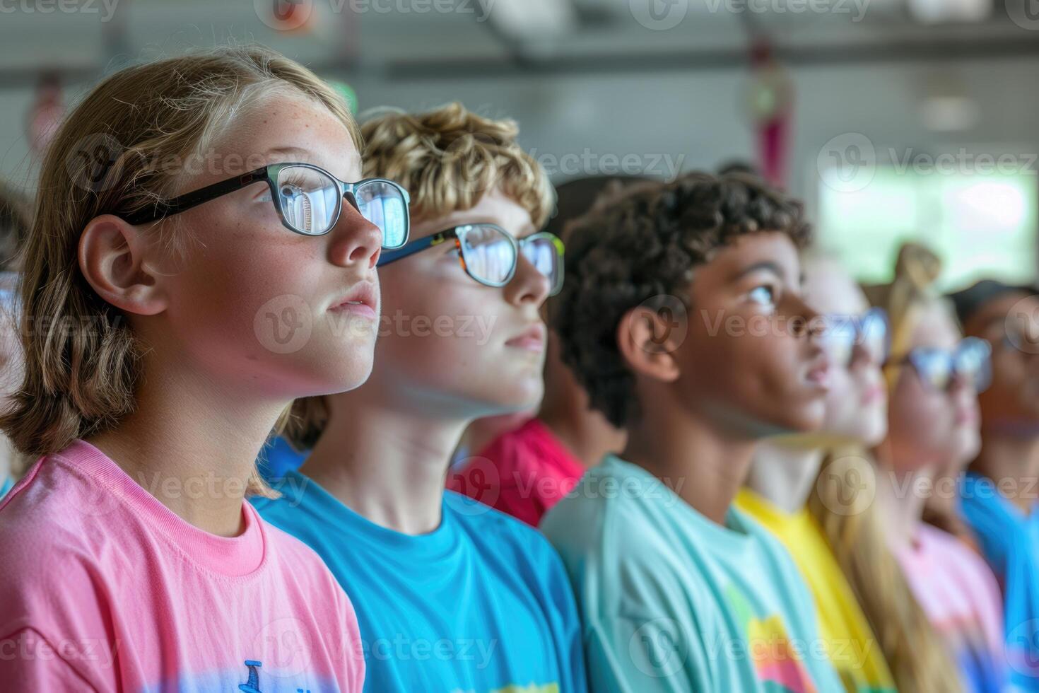 group of teenage students looking at the documents standing in classroom. photo