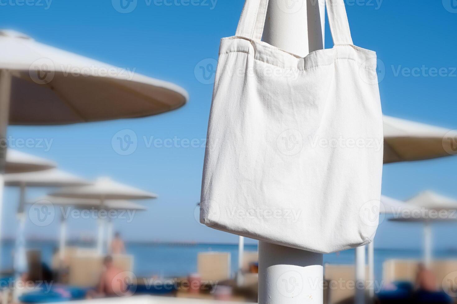 Mockup shopper handbag hanging on the beach photo