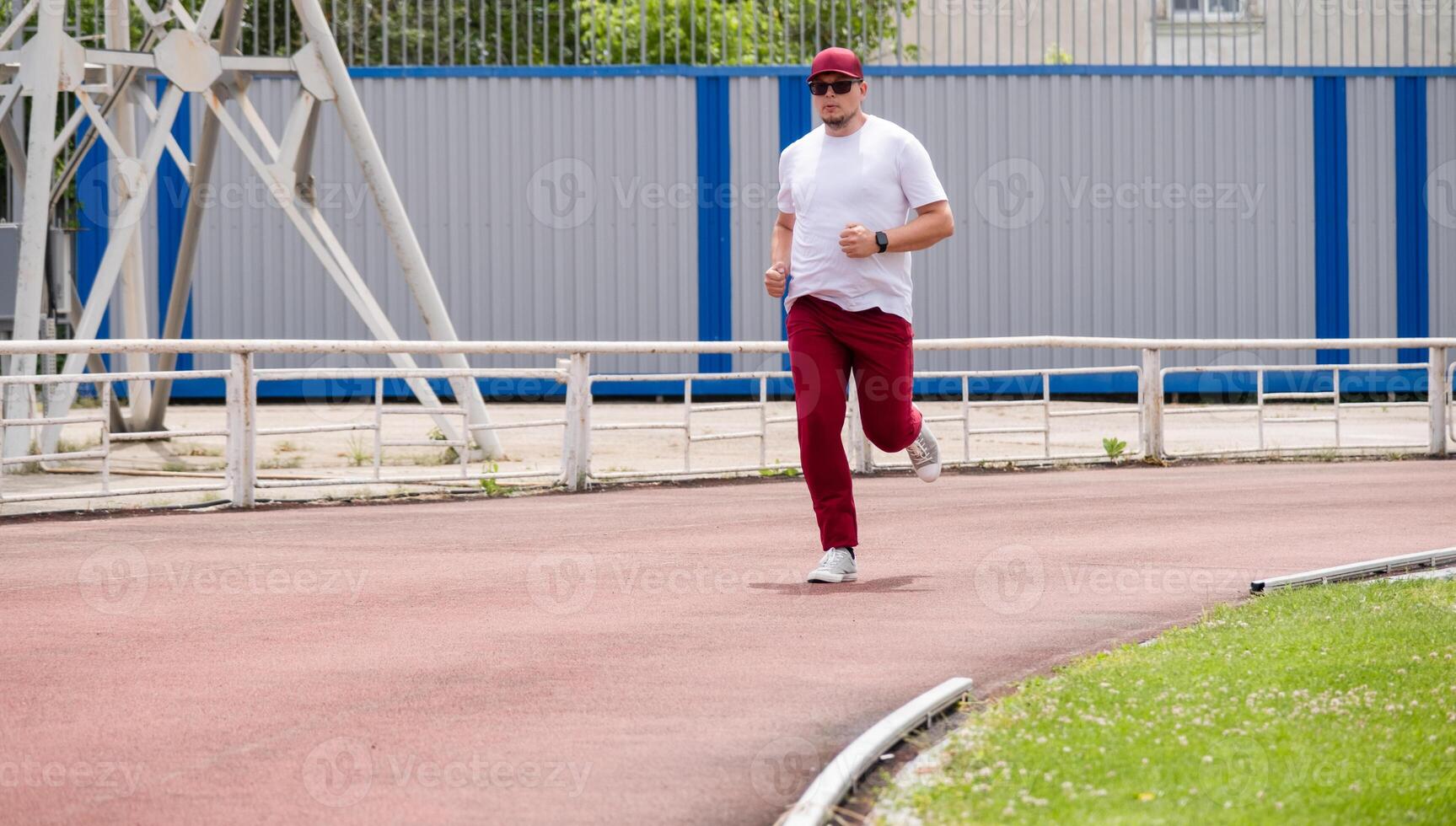 sportsman running in the stadium photo