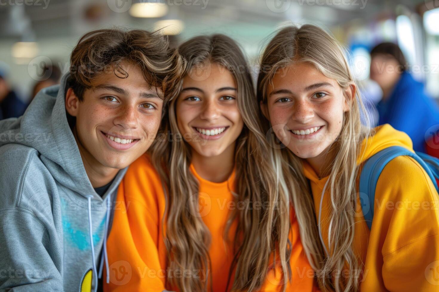 group of three happy teenage students in bright clothes. photo