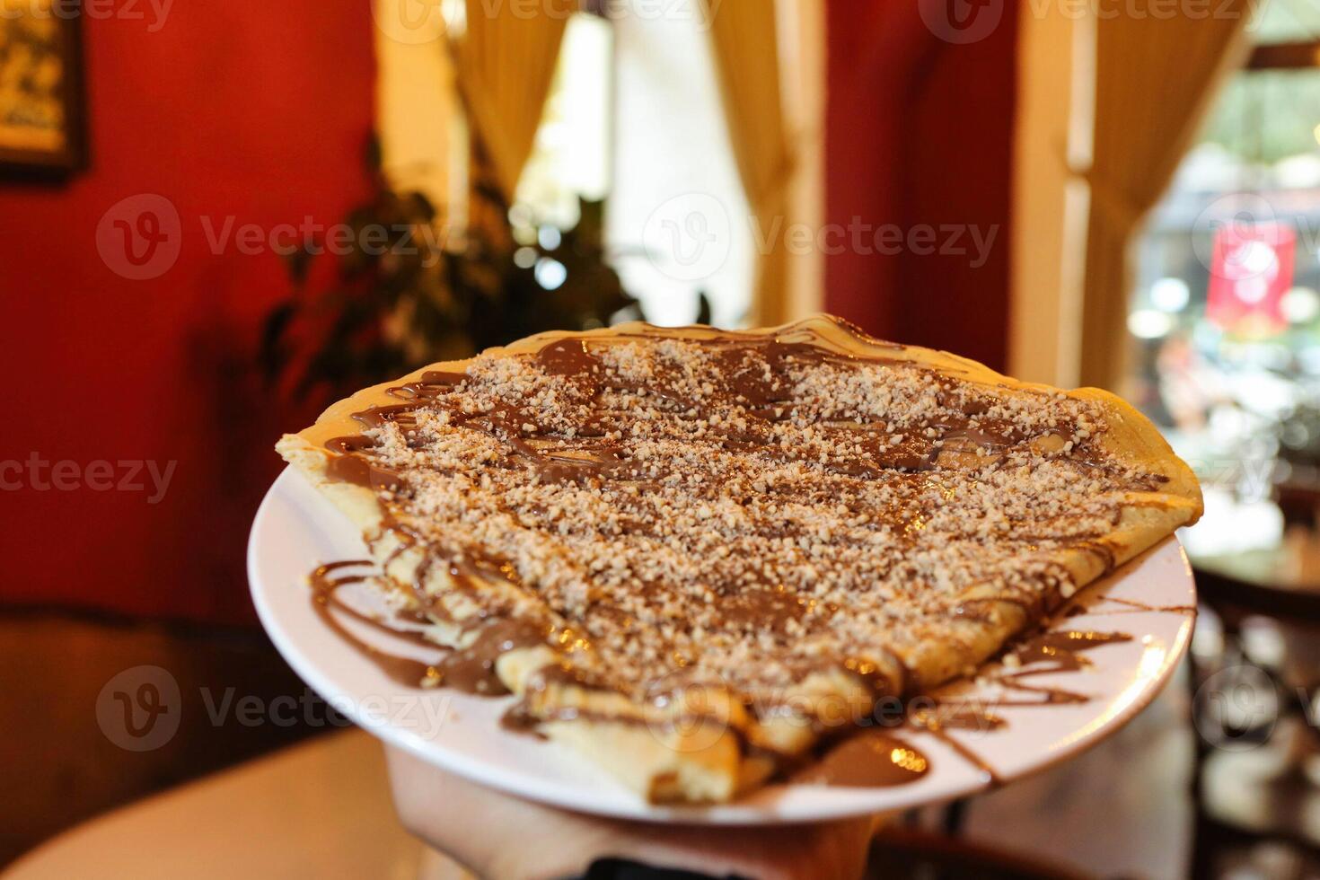 Chocolate Nutella Crepe With Powdered Sugar photo