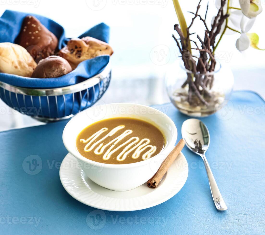 Cup of Coffee and Bowl of Cookies on Table photo
