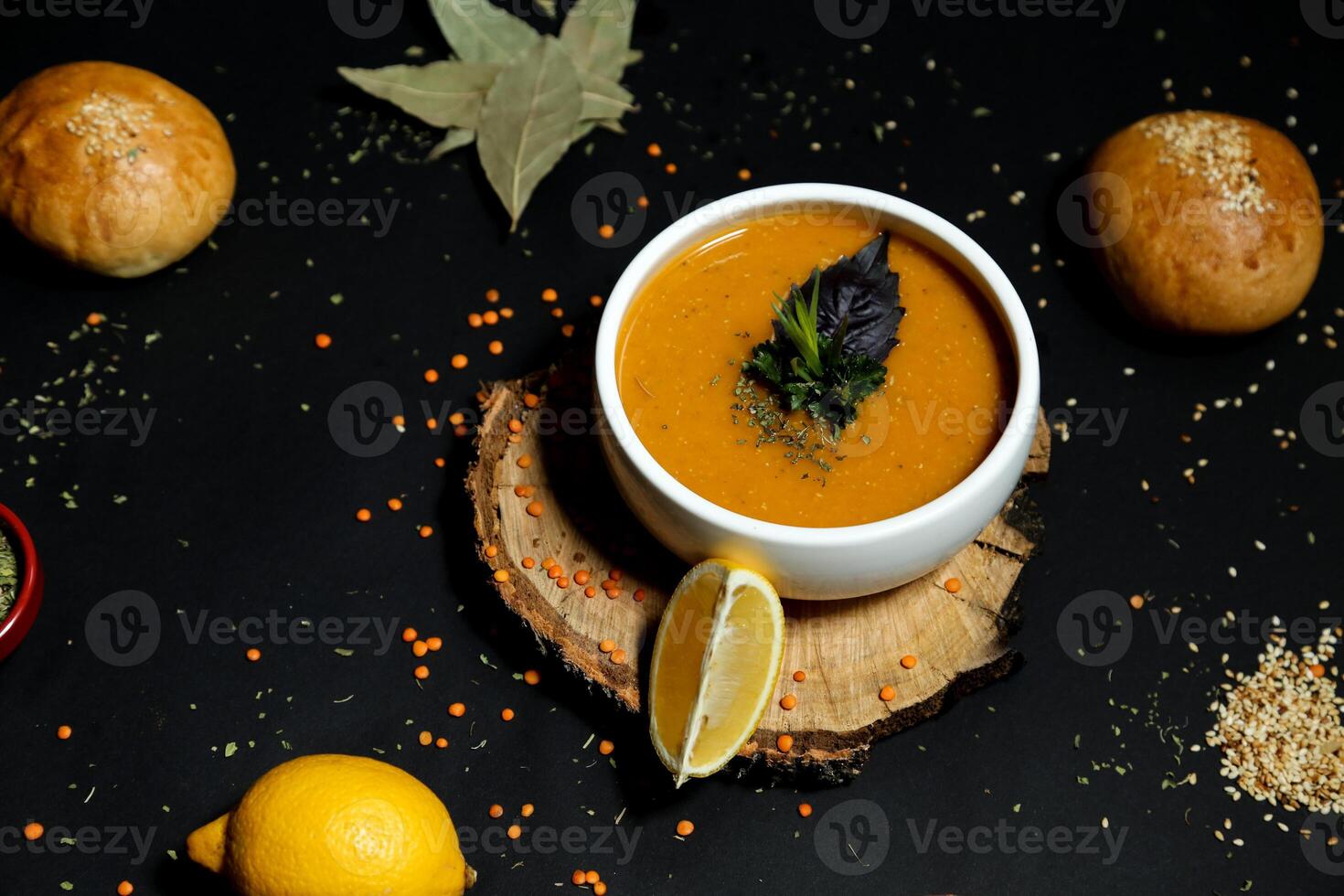Delicious Carrot Soup With a Refreshing Lemon Slice photo