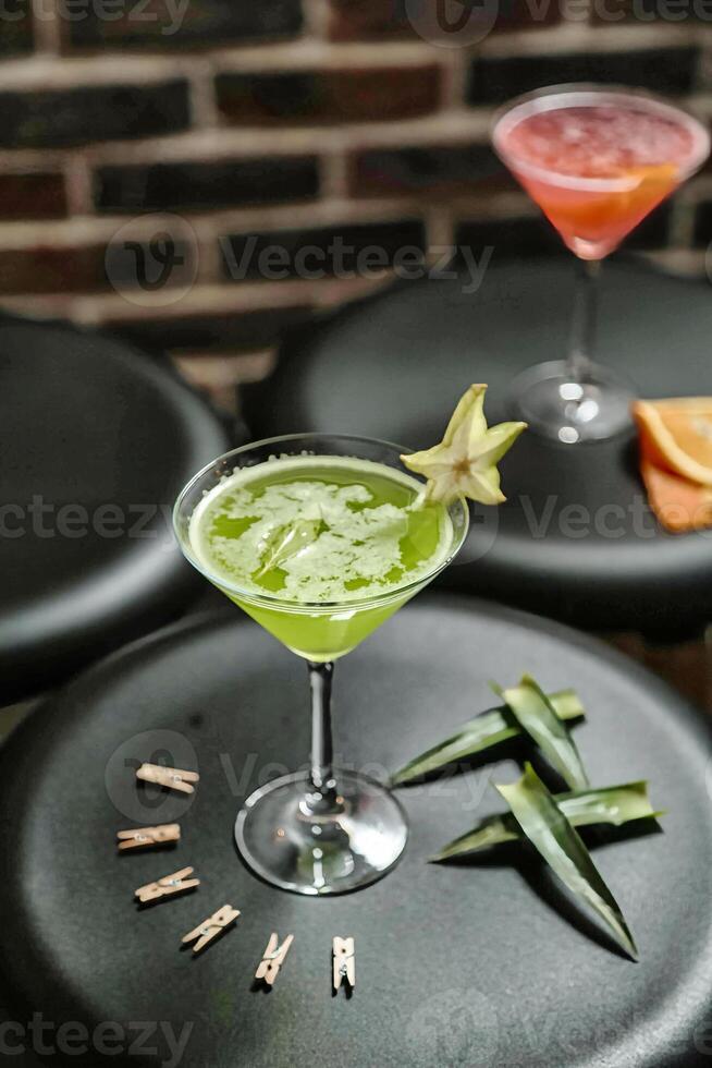 Green Drink Sitting on Black Table photo