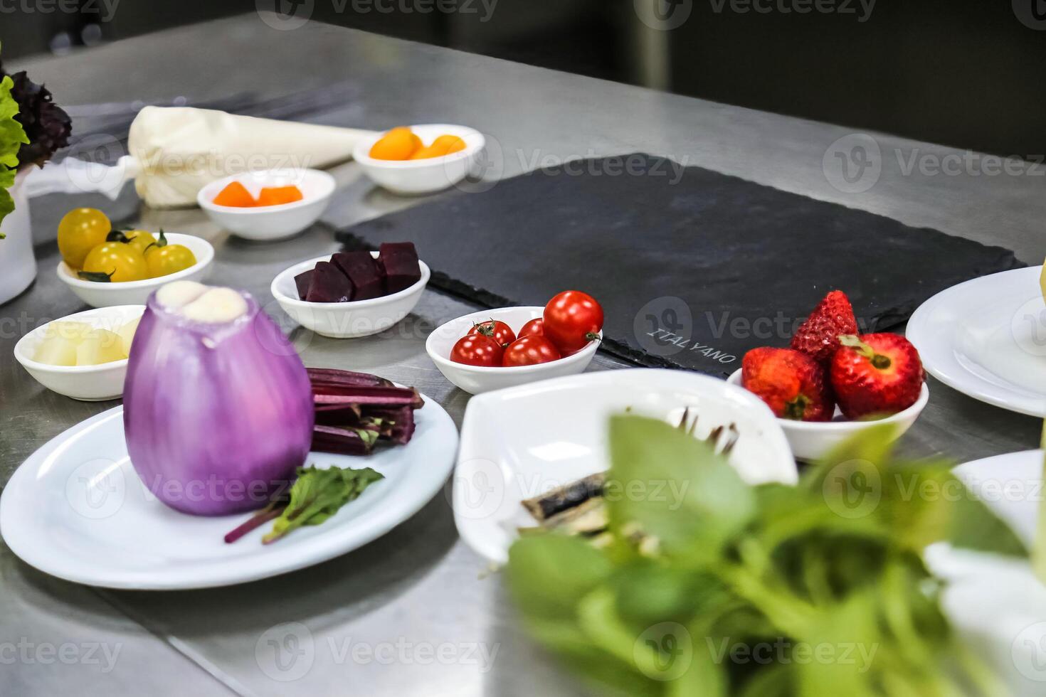 Table With Assorted Food Plates and Vegetable Bowls photo