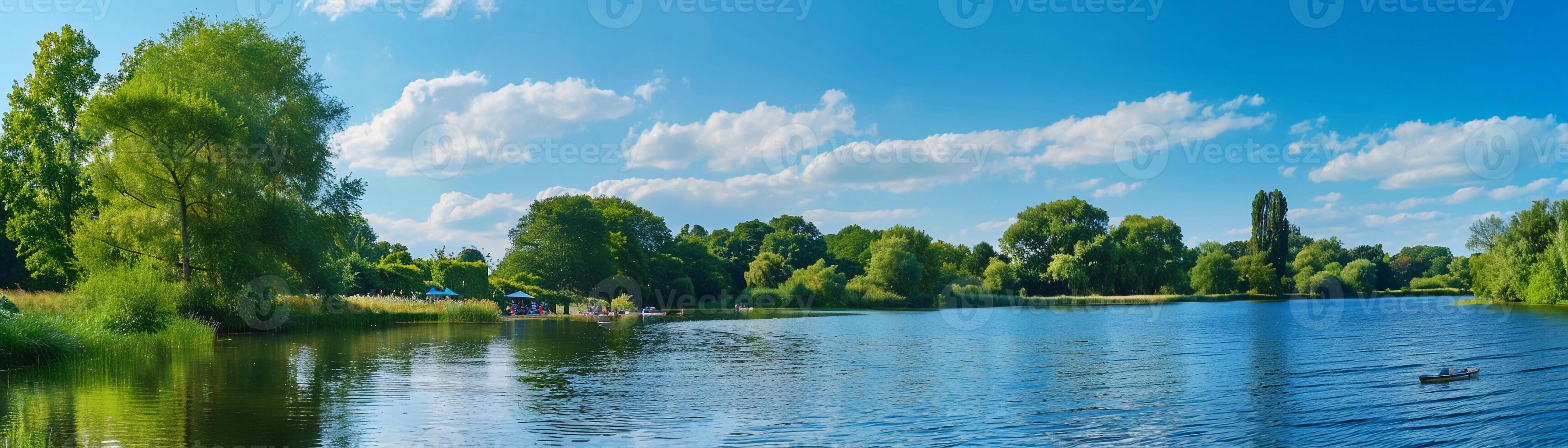 Riverside Picnic, a peaceful riverside scene with people having a summer picnic photo