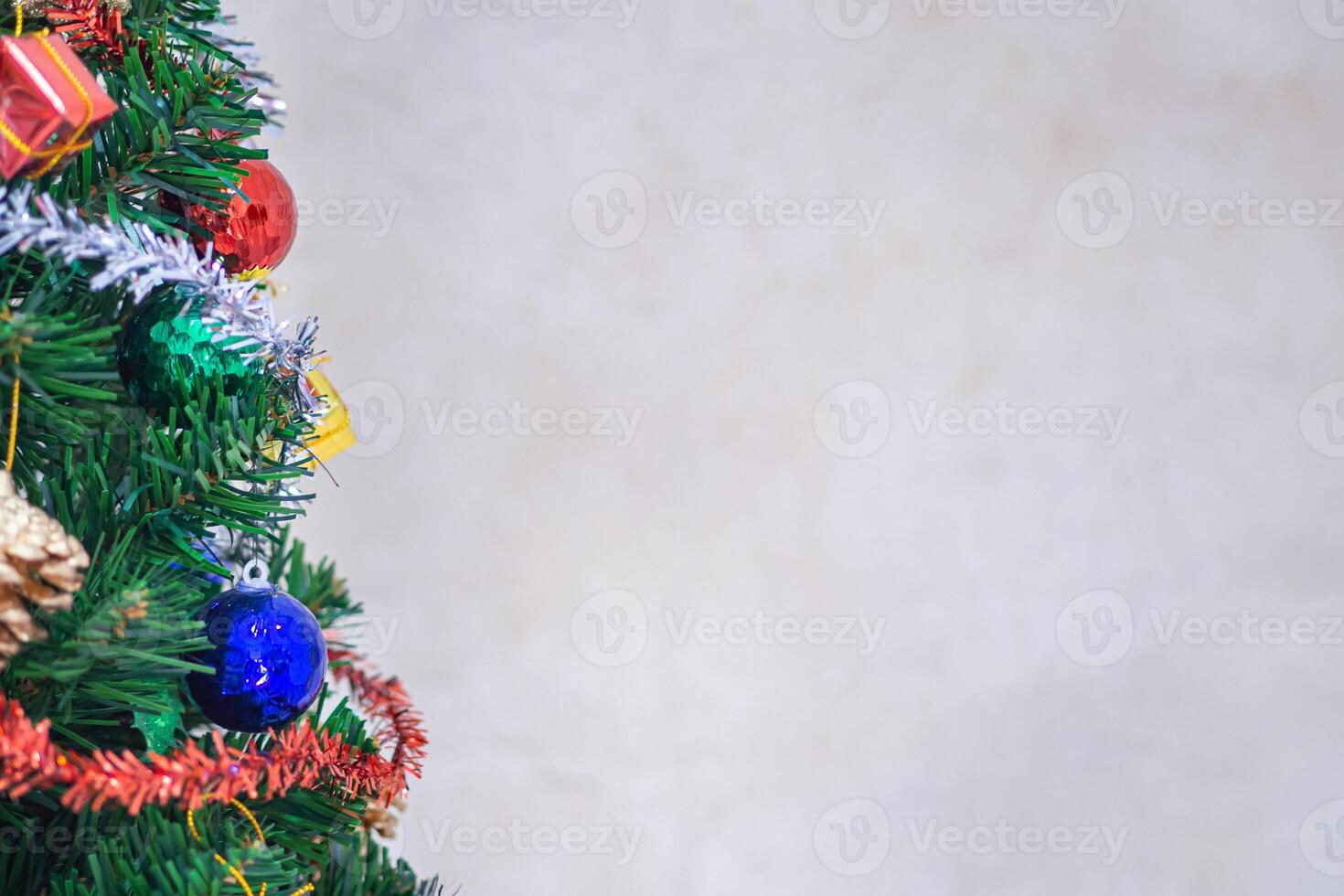 Close-up of Christmas tree background and Christmas decorations with a gift box. The theme of Happy New Year and Xmas. Space for text photo