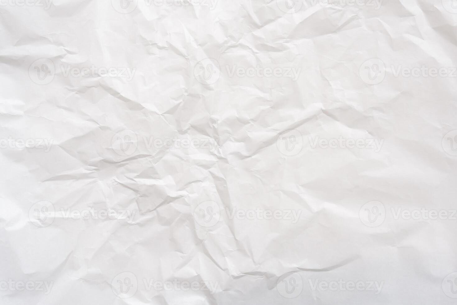 Wrinkled or crumpled white stencil or tissue paper used for crumpled paper background texture. photo