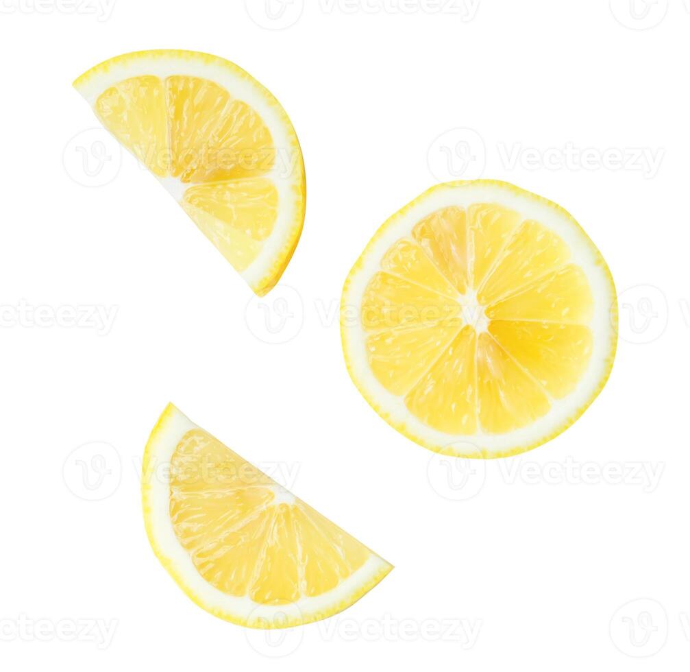 Top view set of fresh yellow lemon slices and halves scattering isolated on white background with clipping path photo