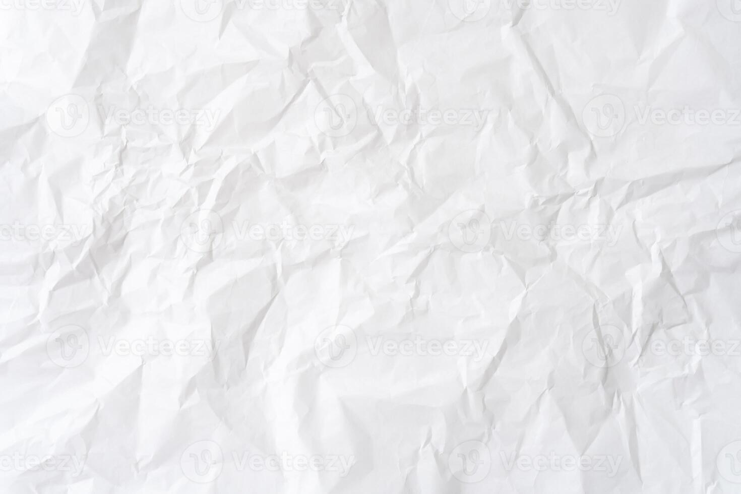 Wrinkled or crumpled white stencil paper or tissue after use in toilet or restroom with large copy space used for background texture in decorative art work photo