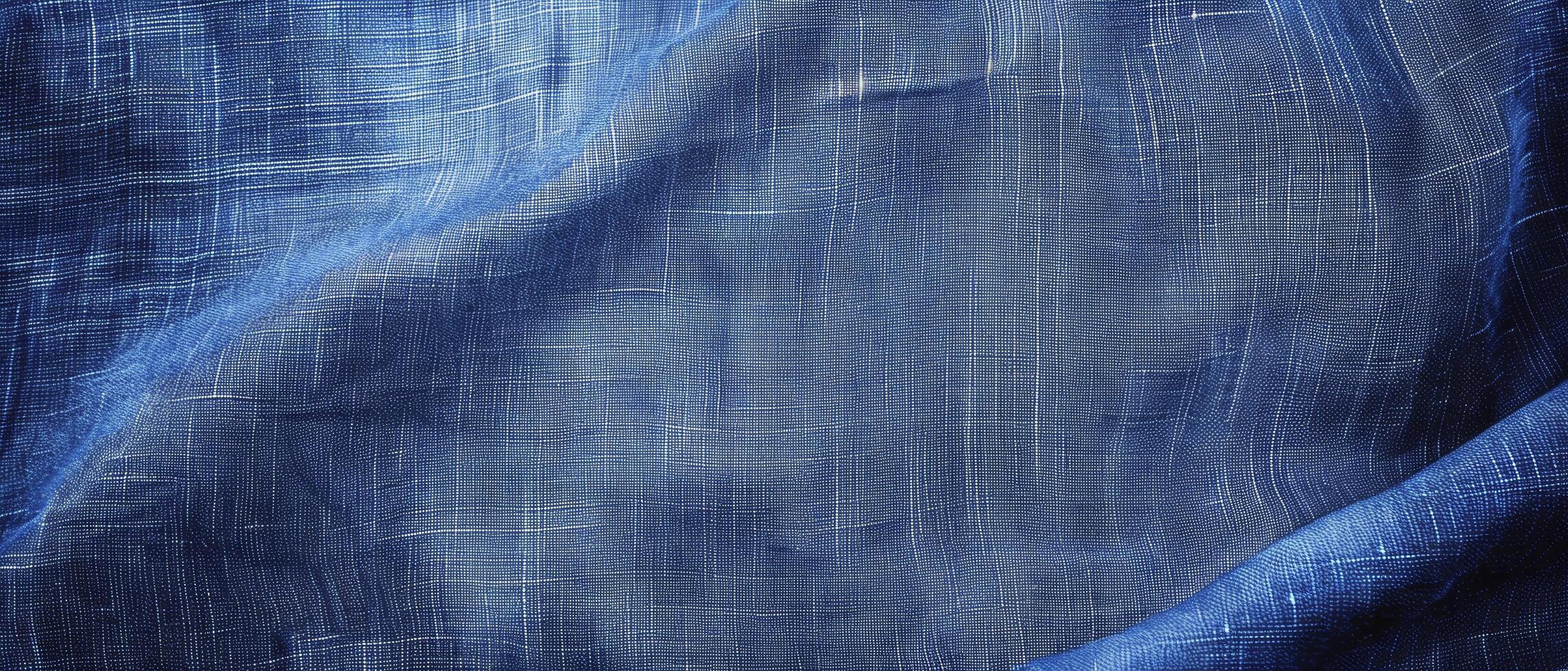 a solid blue background with a smooth fabric texture photo