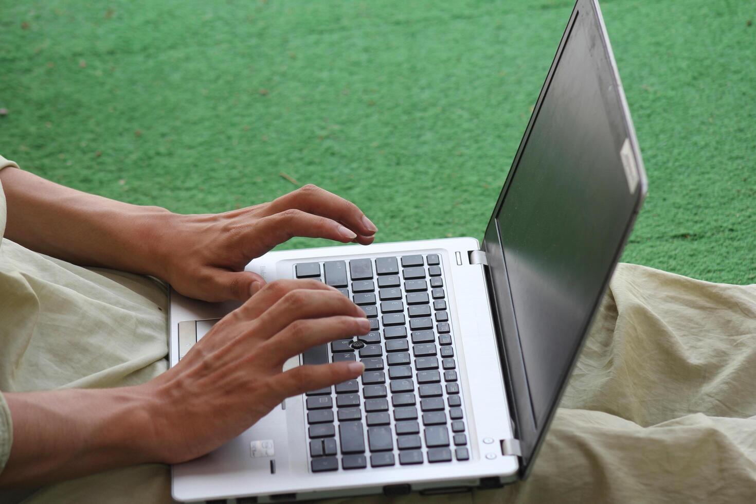 Close up image of Man hands typing on laptop computer keyboard, working, business and technology, internet network communication concept photo