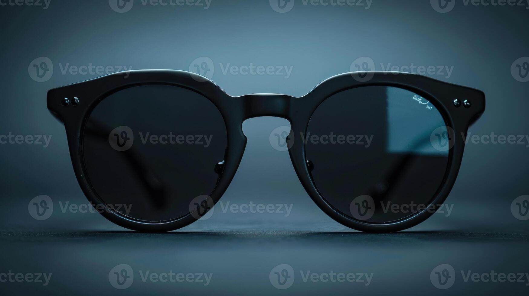 Sleek Black Sunglasses with Studio Lighting on Minimal Background photo