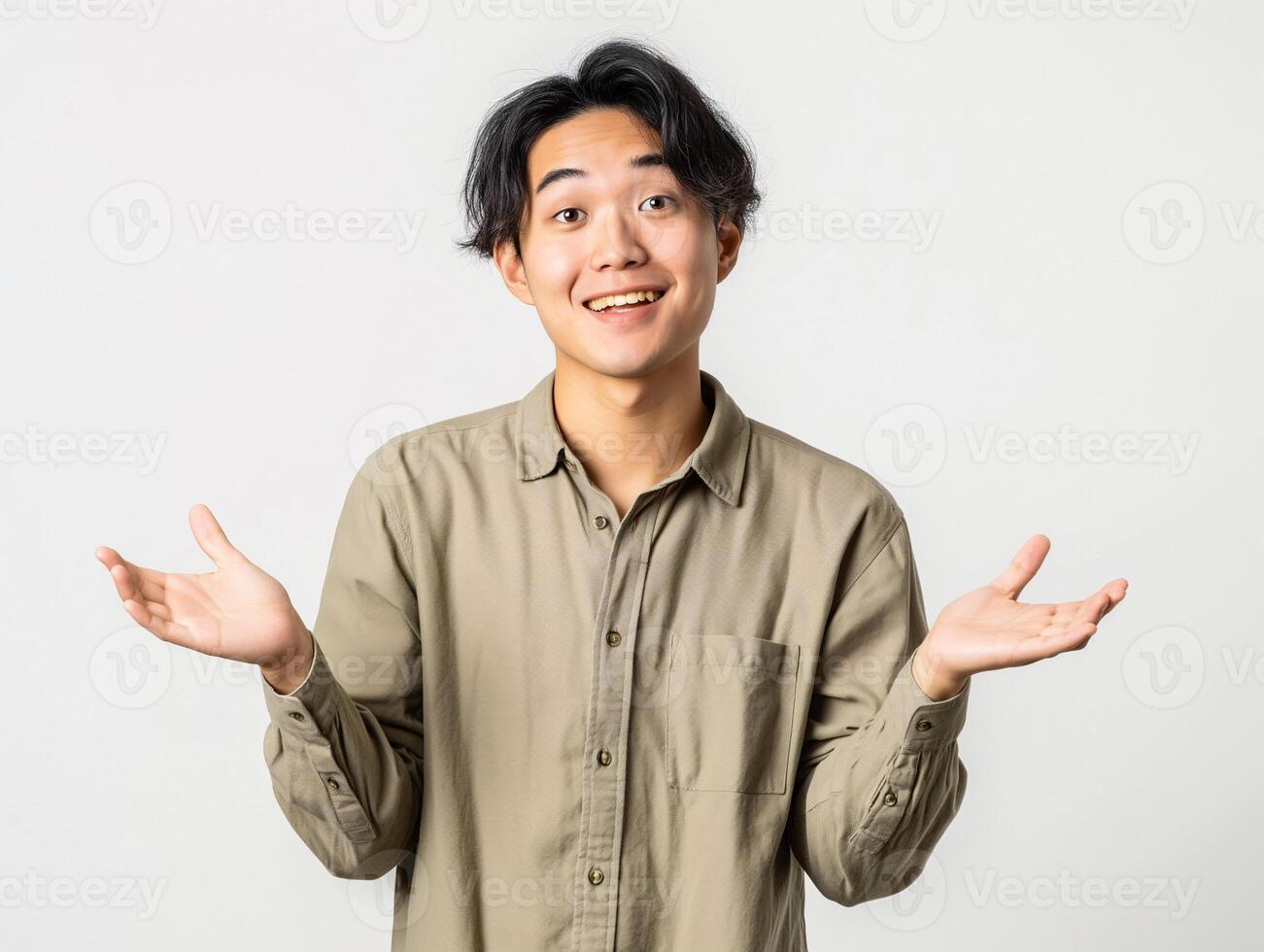 Young Asian Man Shrugging in Casual Khaki Shirt Expressing Uncertainty in Studio photo