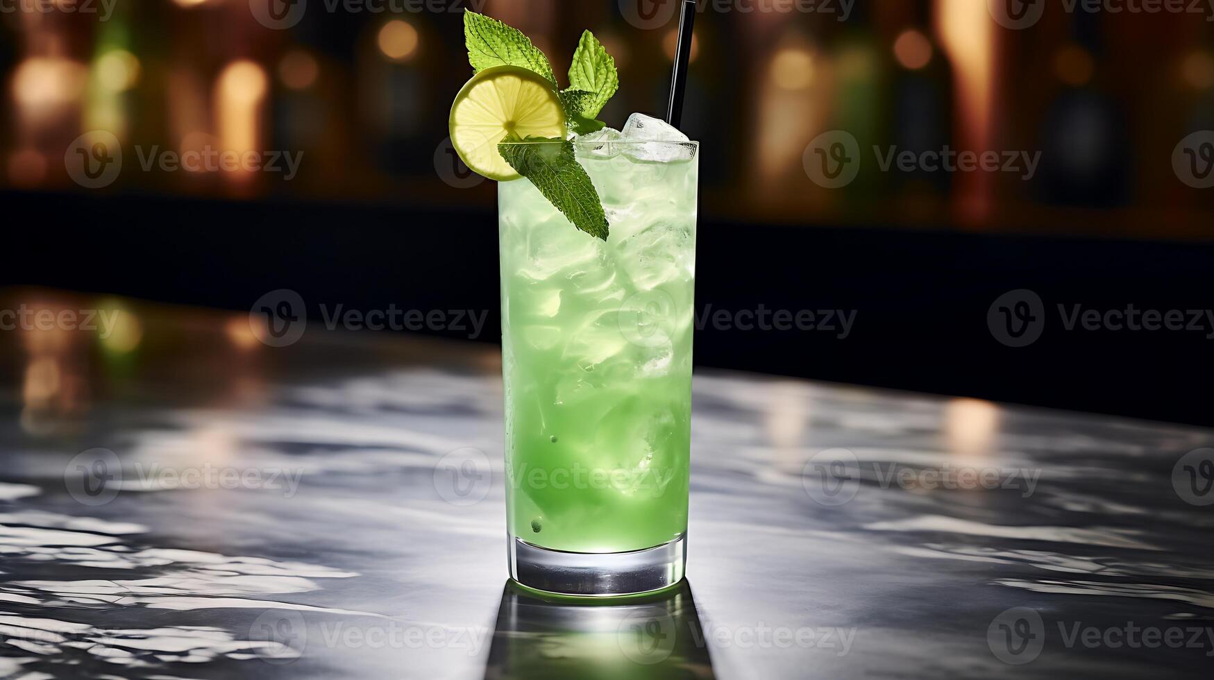 A glass of lemonade, garnished with limes and lime slice. photo
