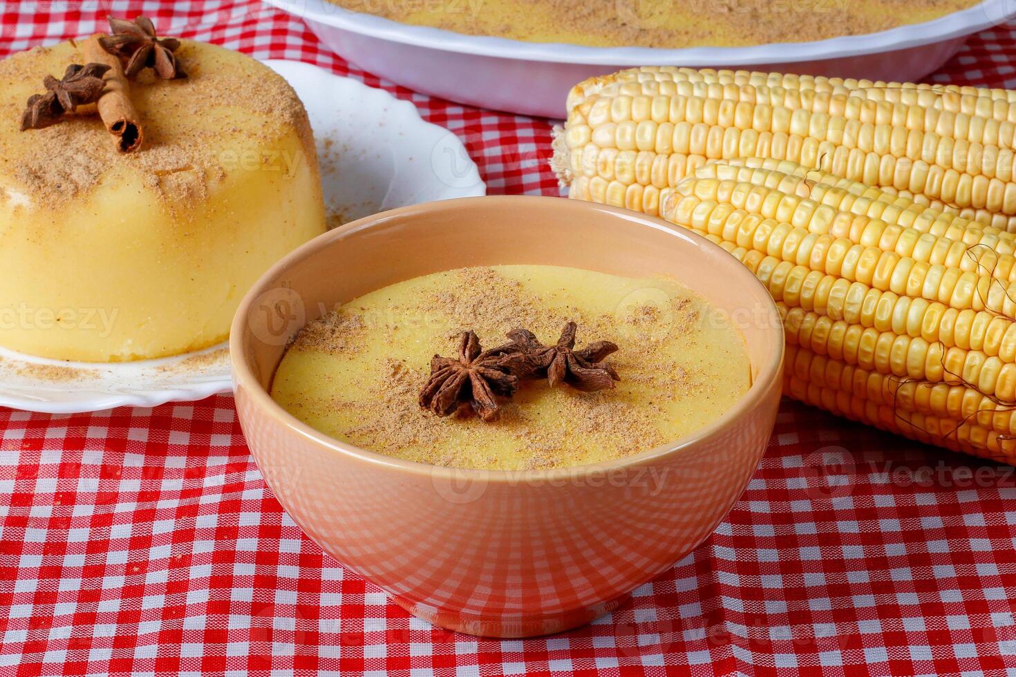 Curau, cream of corn sweet and dessert typical of the Brazilian cuisine, placed in ceramic bowl on wooden table. photo