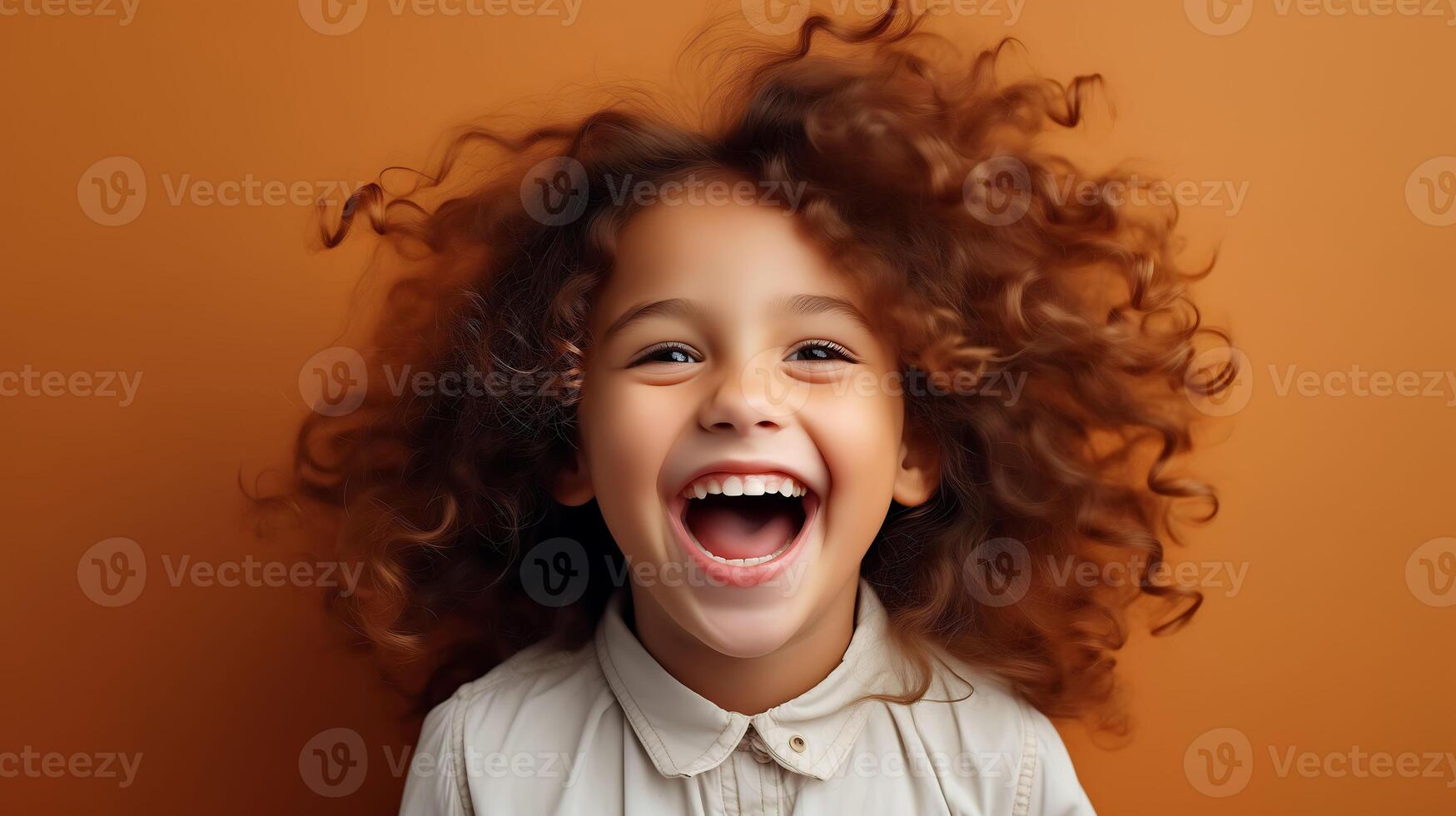 Photo of little funny brown hair boy isolated on brown color background