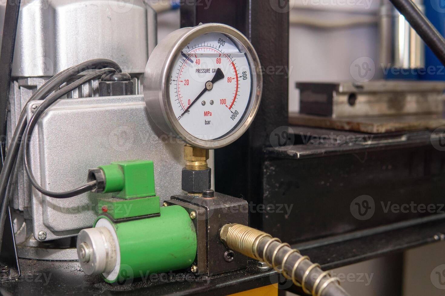 pressure gauge, pressure sensor on the compressor of an industrial machine photo
