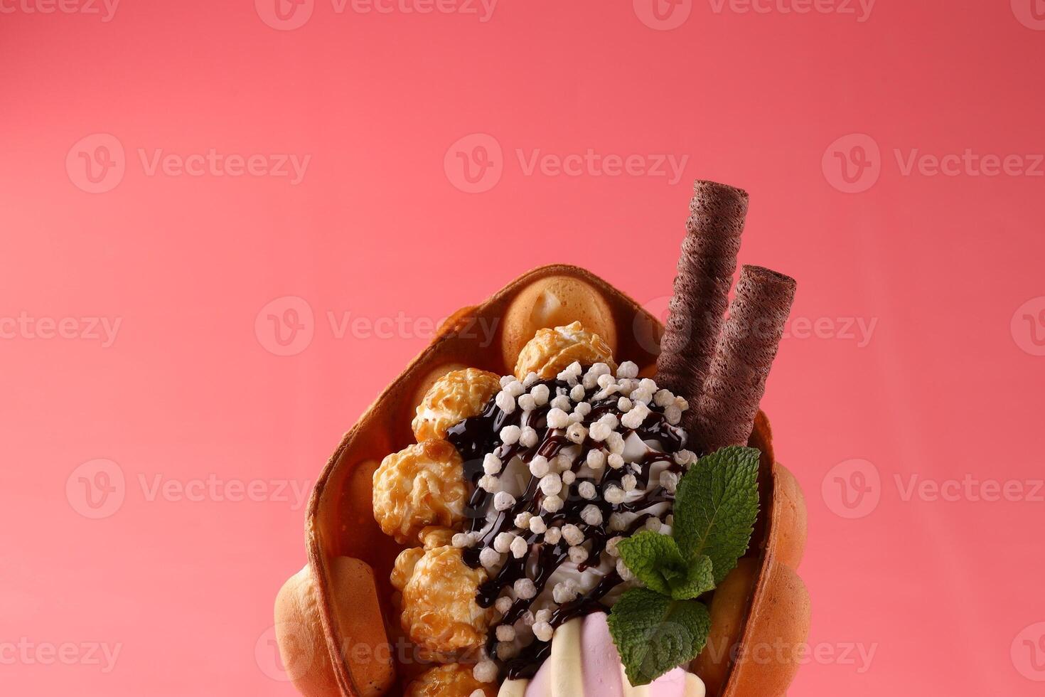 Hong kong or bubble waffle with ice cream and fruits isolated on white background photo