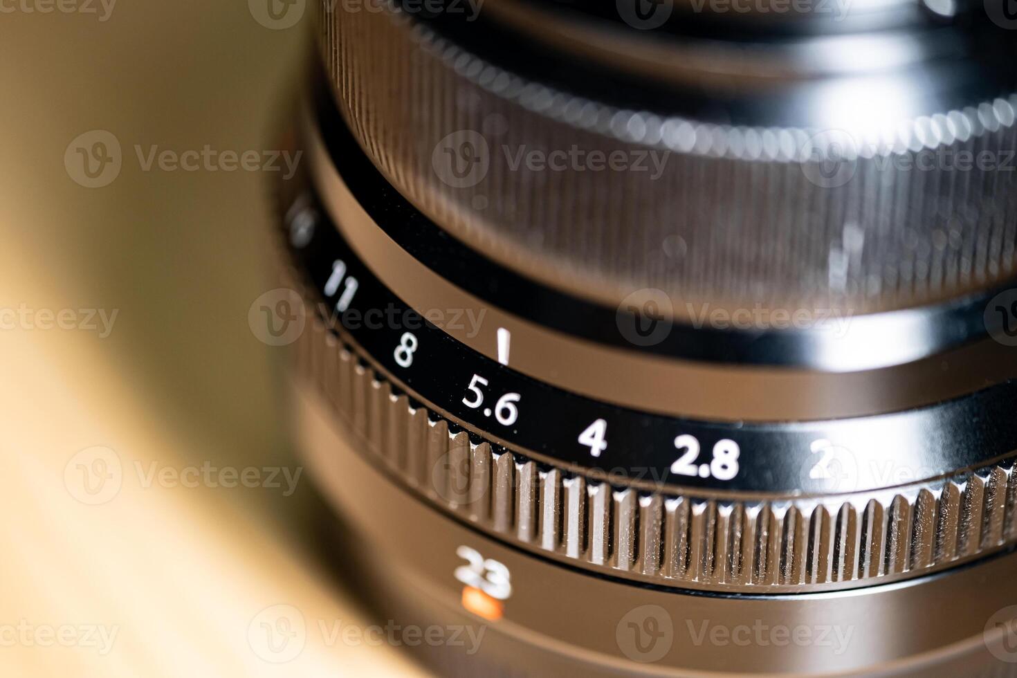 Close-up of camera lens with aperture and focal length markings photo