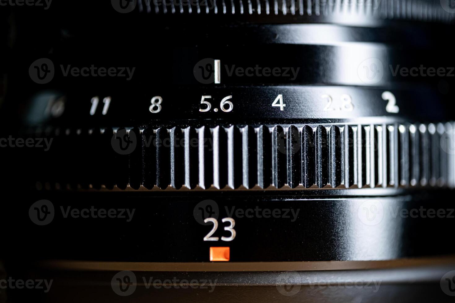 Close-up of camera lens with aperture and focal length settings photo