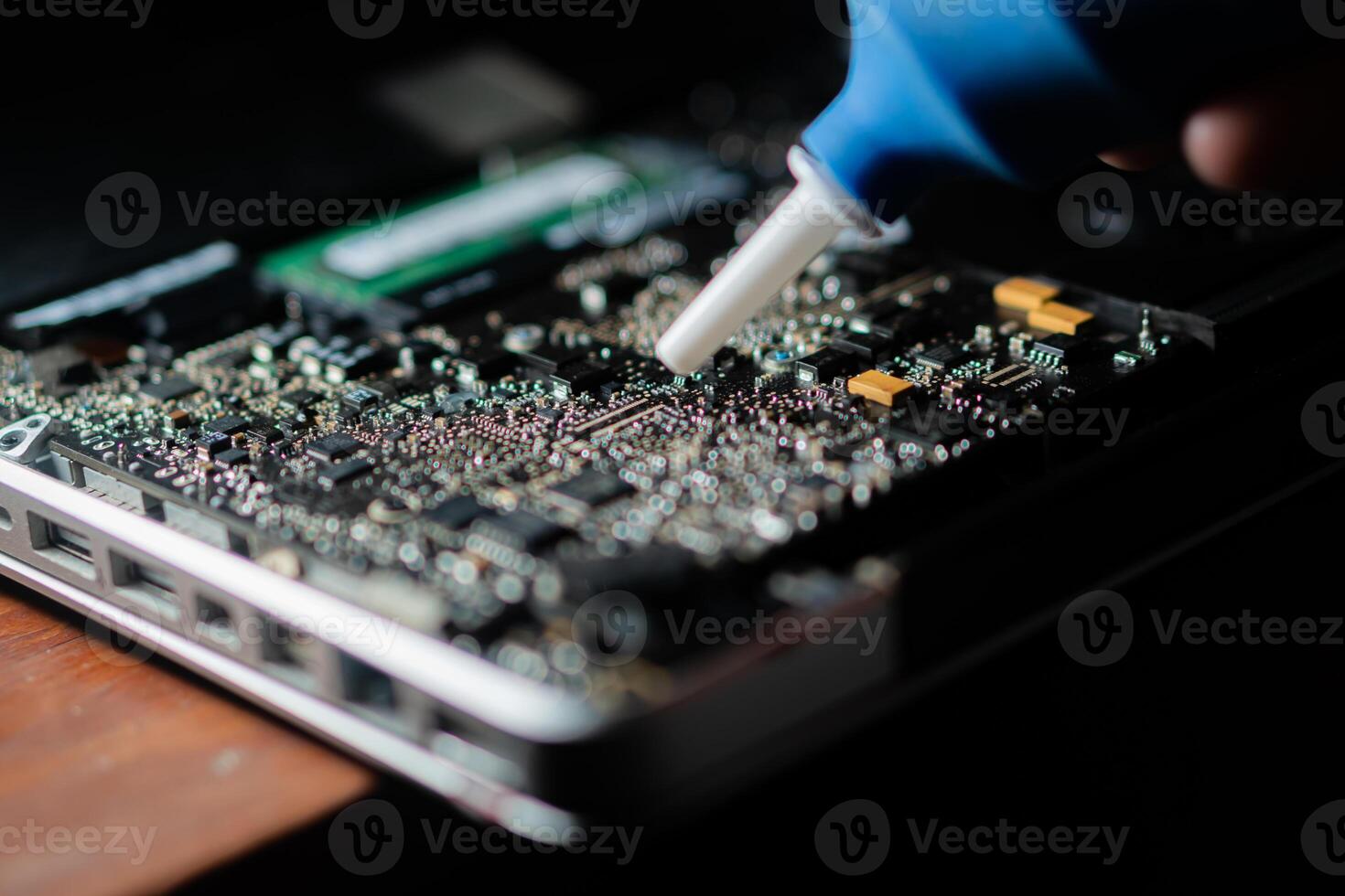 Cleaning Dust from Laptop Motherboard photo