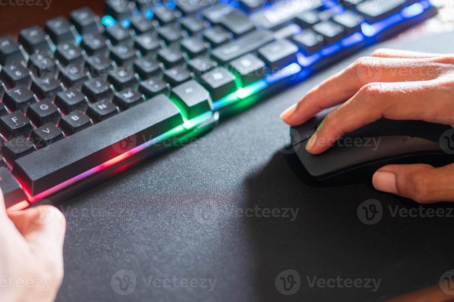 RGB Keyboard and Wireless Mouse on Mouse Pad photo