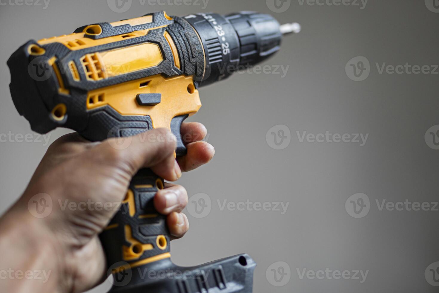 Hand Holding Cordless Power Drill photo