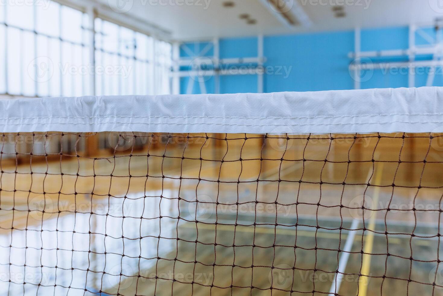 Empty Indoor Sports Arena with Badminton Net, Highlighting Athletic and Recreational Spaces. photo