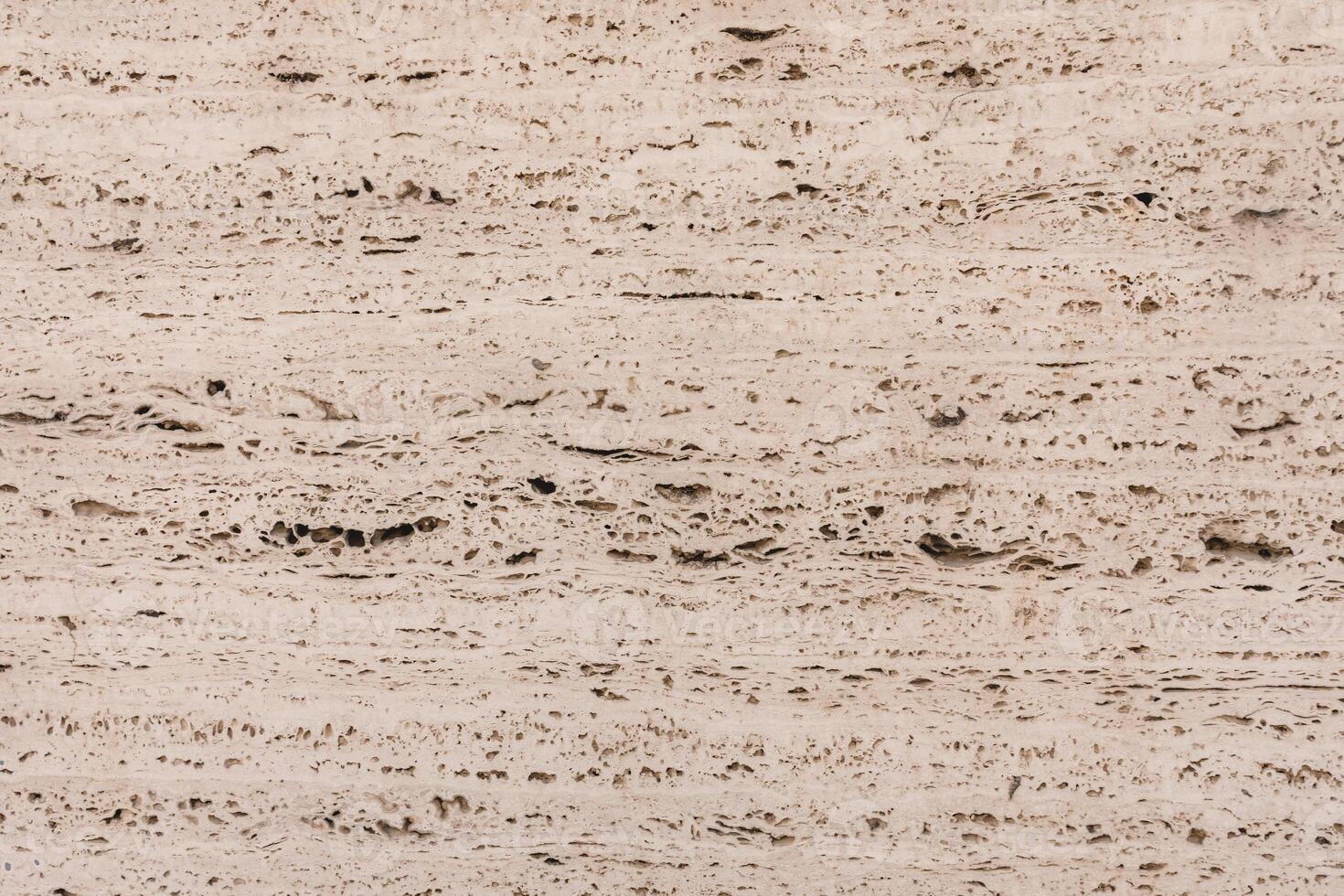 Textured Beige Travertine Stone Background With Natural Patterns and Rough Surfaces. photo
