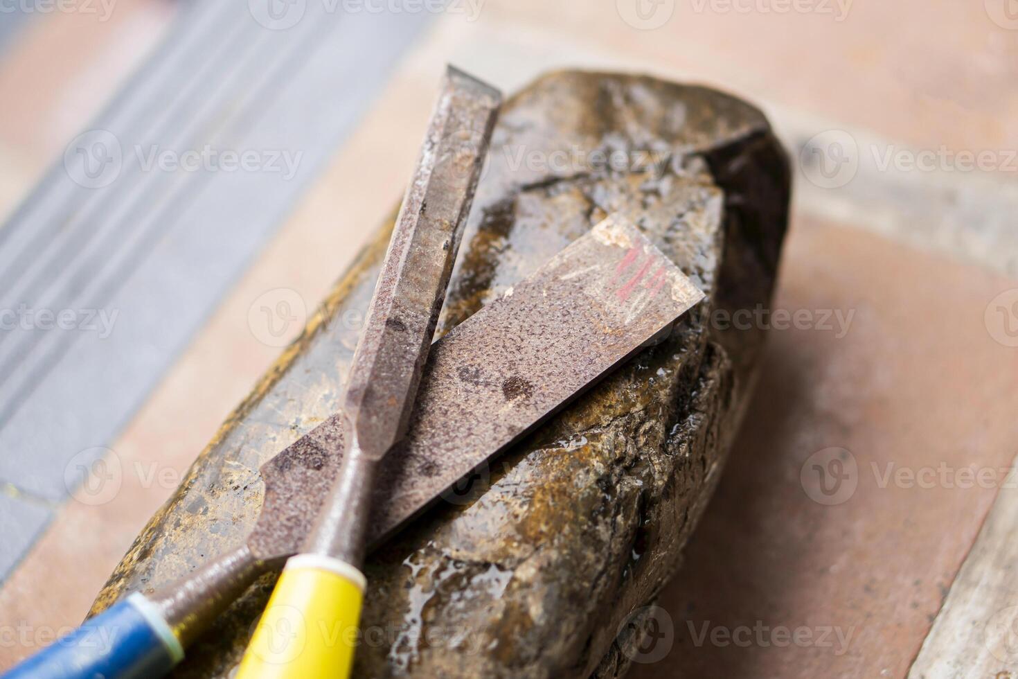 Chisels on Wet Sharpening Stone photo